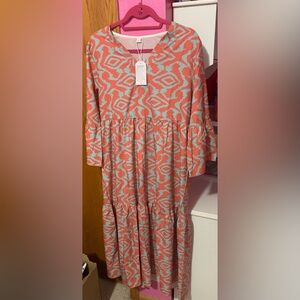 NWT. Size Large. Coral and blue flowy single lined dress.